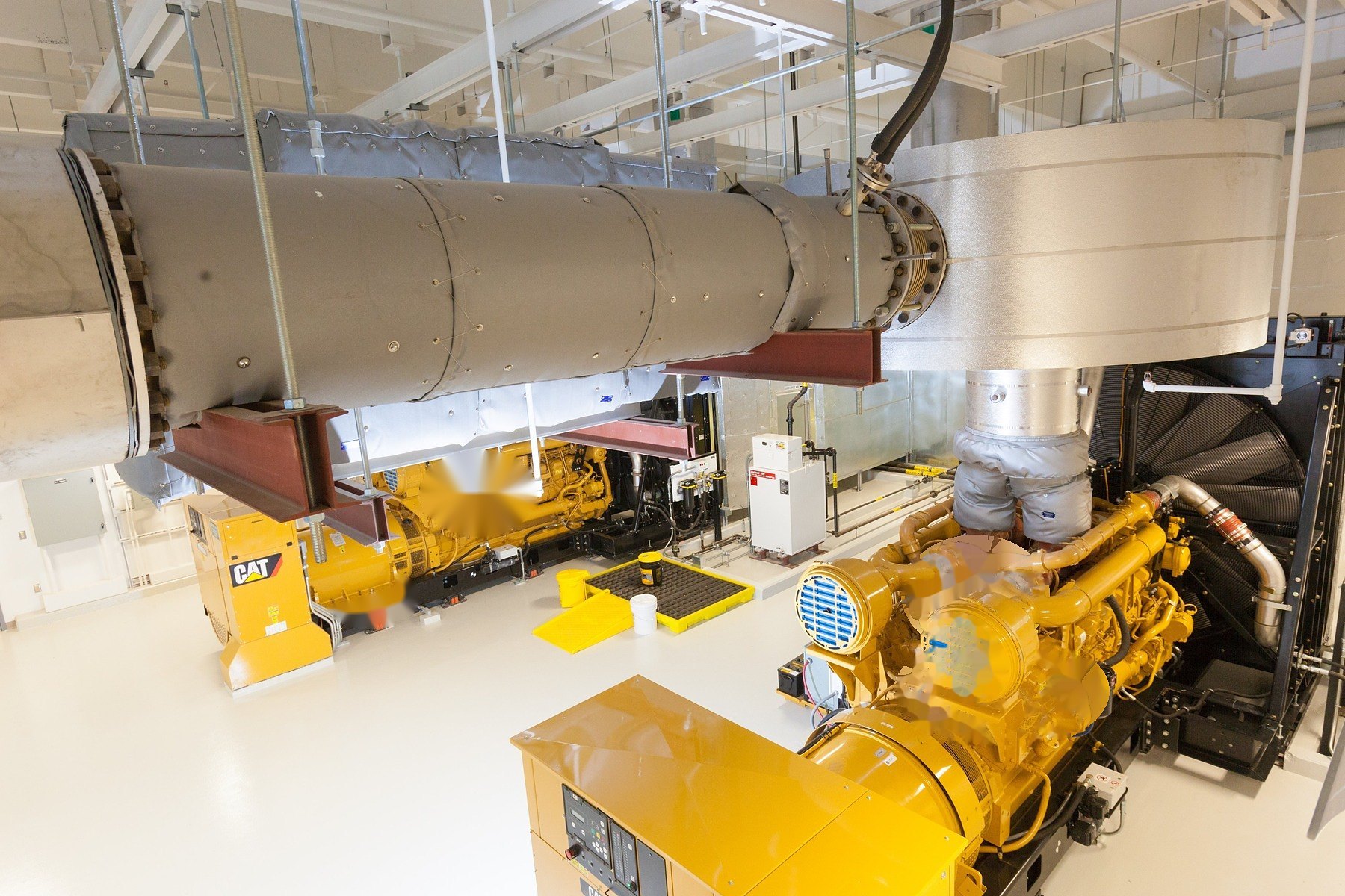 Insulated exhaust and aftertreatment serving generator sets