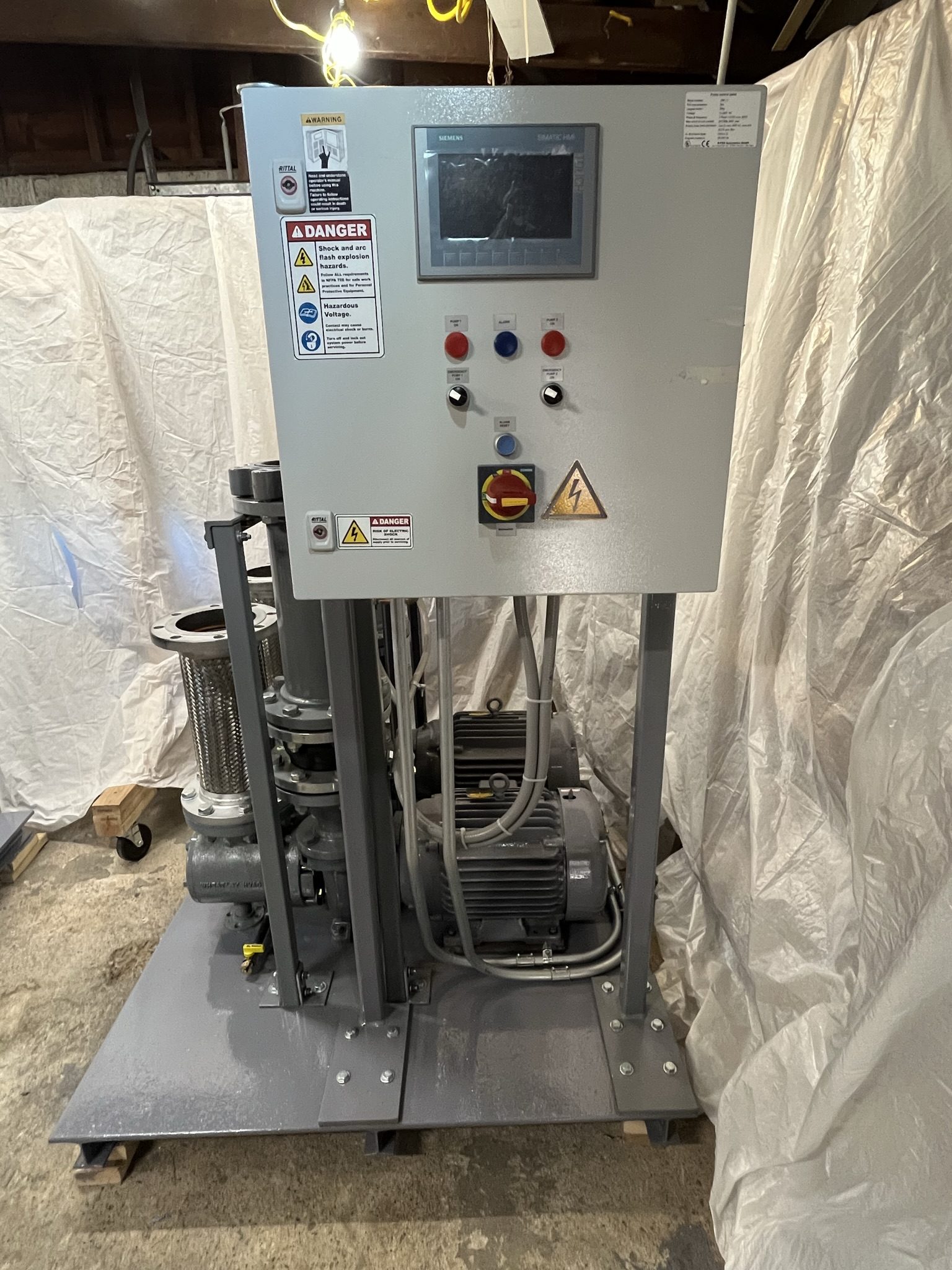 Pump skid control panel, motors, and suction strainer